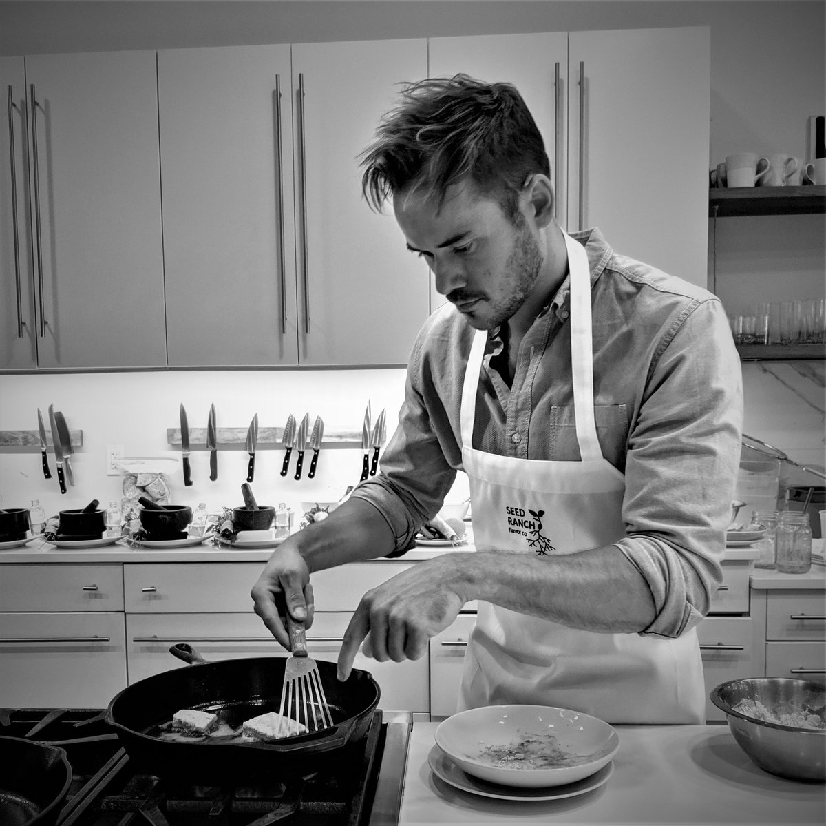 David Delcourt, CEO & Chief of Flavor, cooking in his kitchen